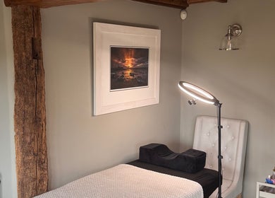 Cozy treatment room at Enhanced by El in Peldon, England, GB showcasing a serene aesthetic setup.