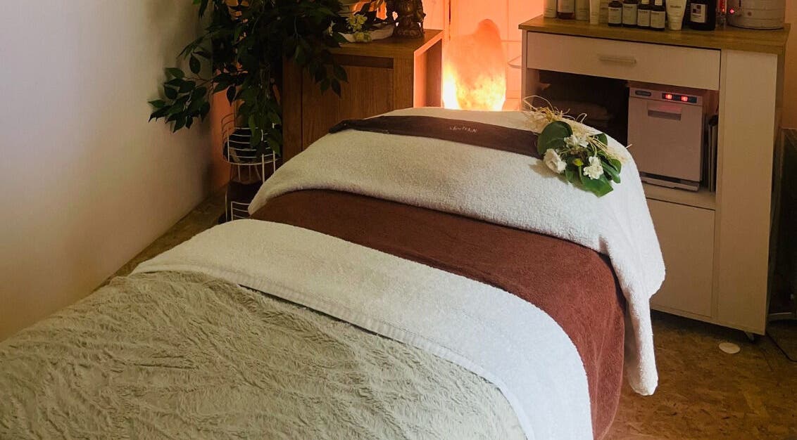 Relaxing treatment room at The Beauty Snug in Currie, Scotland, GB, showcasing tranquil ambiance and decor.