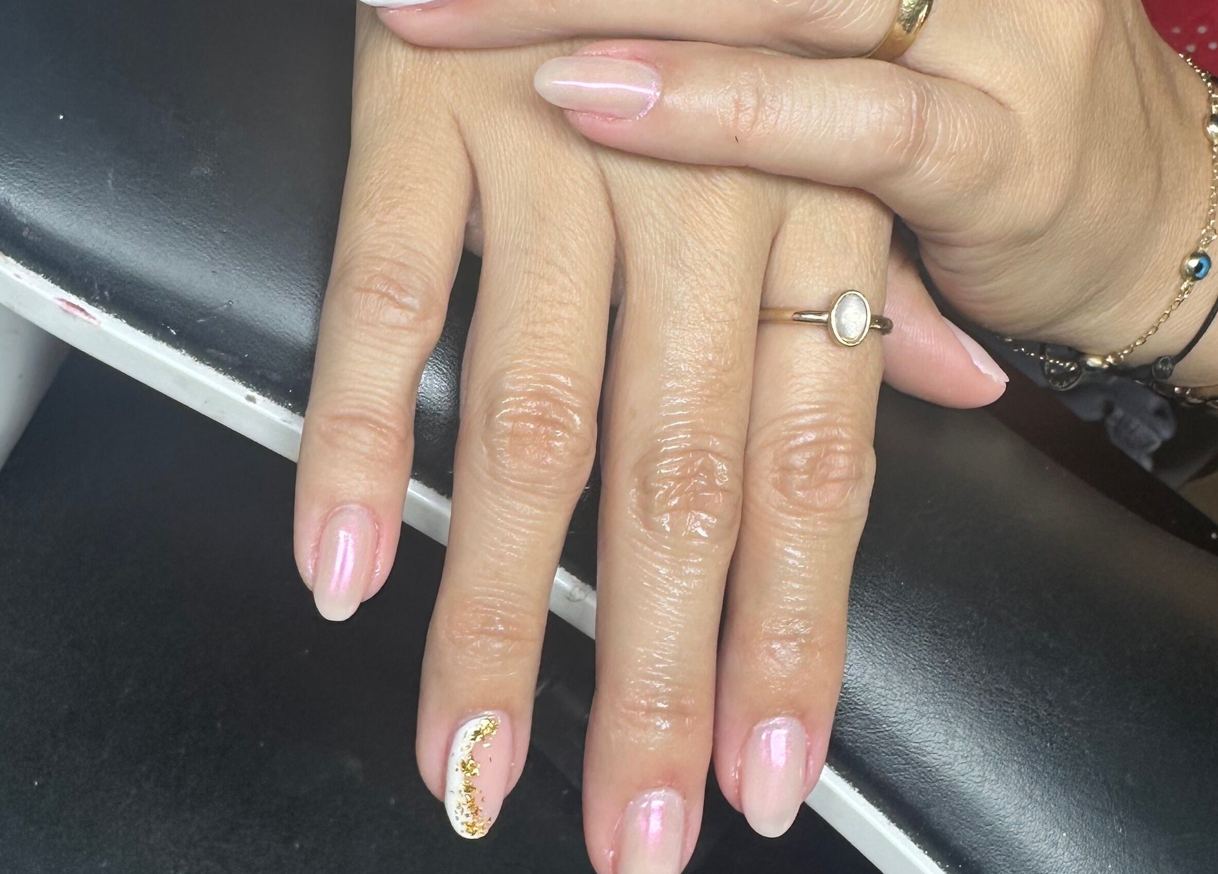 Elegant manicure at Studio777, Cole Bay, Sint Maarten, SX showcasing pink and gold nail art.