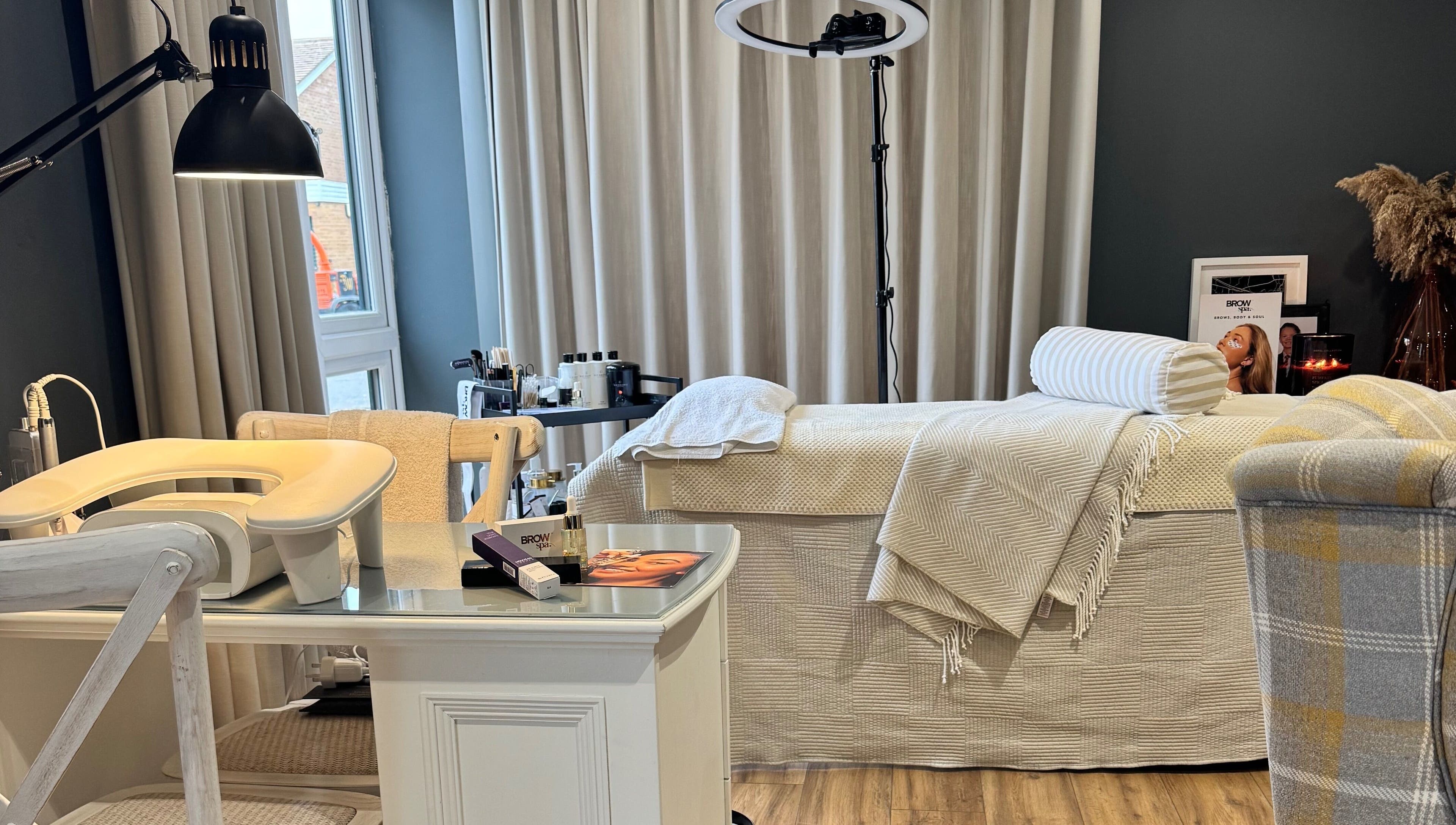Comfortable treatment room at Brows By Jenna, Northampton, England, GB with a plush bed and calming decor.