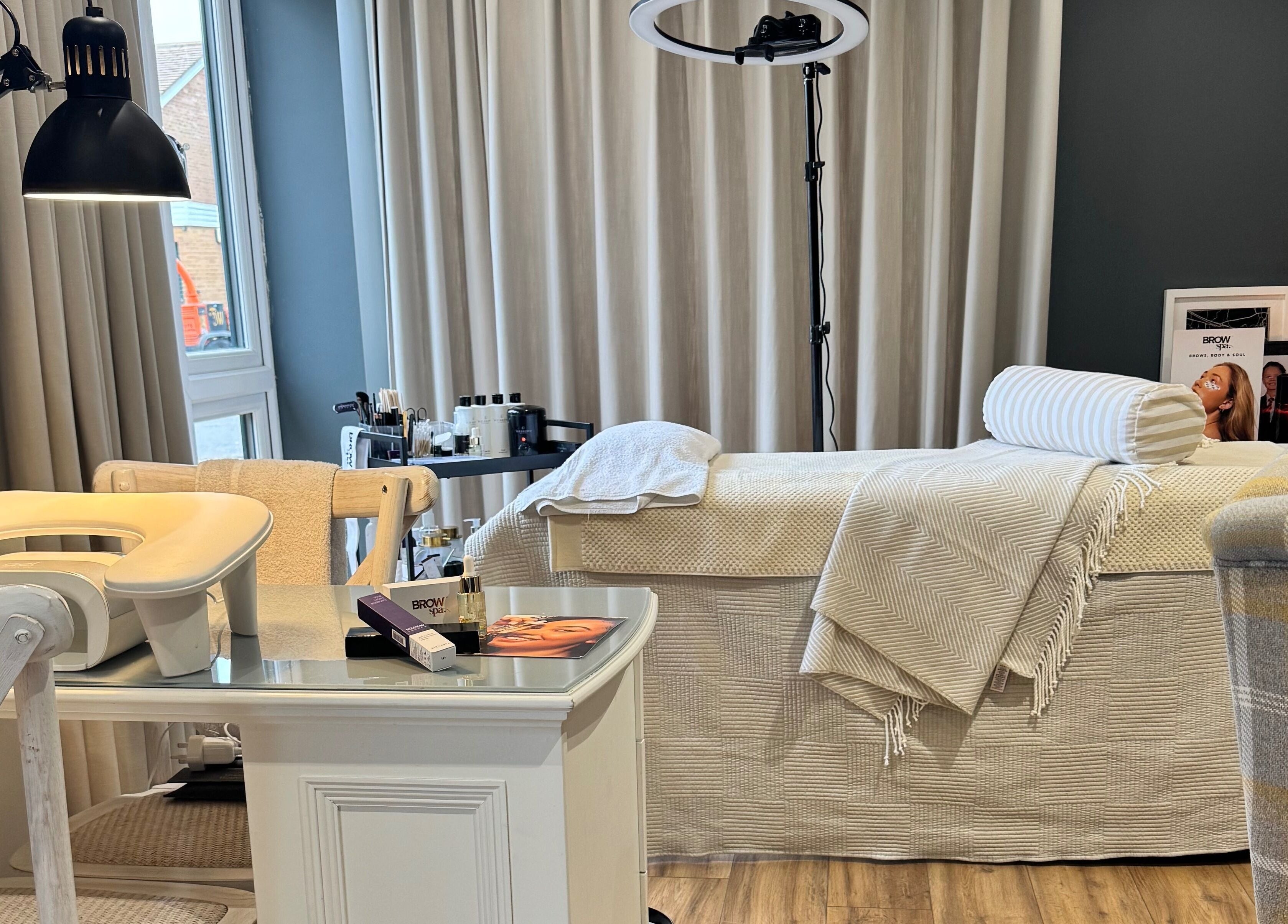 Comfortable treatment room at Brows By Jenna, Northampton, England, GB with a plush bed and calming decor.