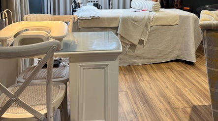 Elegant treatment room at Brows By Jenna in Northampton, England, GB featuring a cozy bed and stylish decor.