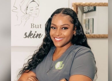 Smiling professional at Unblemished by Tish (FLORIDA), Davie, Florida, US, embodying wellness and beauty expertise.