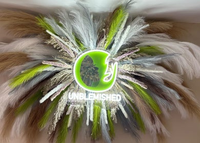 Floral display with Unblemished by Tish logo at Davie, Florida, US beauty venue.