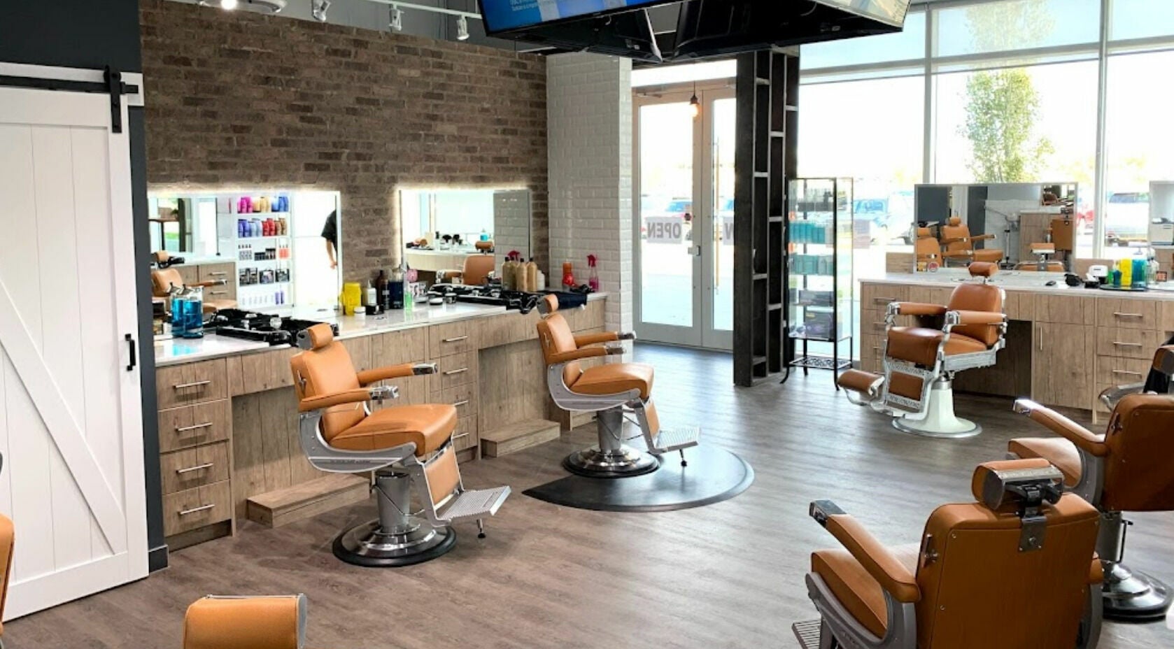 Modern barber chairs at Denim&Smith Deerfoot Mall in Calgary, Alberta, CA, offering stylish grooming services.