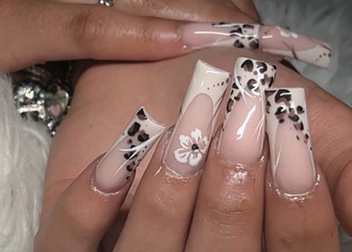 Detailed leopard and floral nail art at Demi.DidThem, Port St. Lucie, Florida, US showcasing elegance.