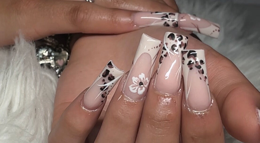 Detailed leopard and floral nail art at Demi.DidThem, Port St. Lucie, Florida, US showcasing elegance.