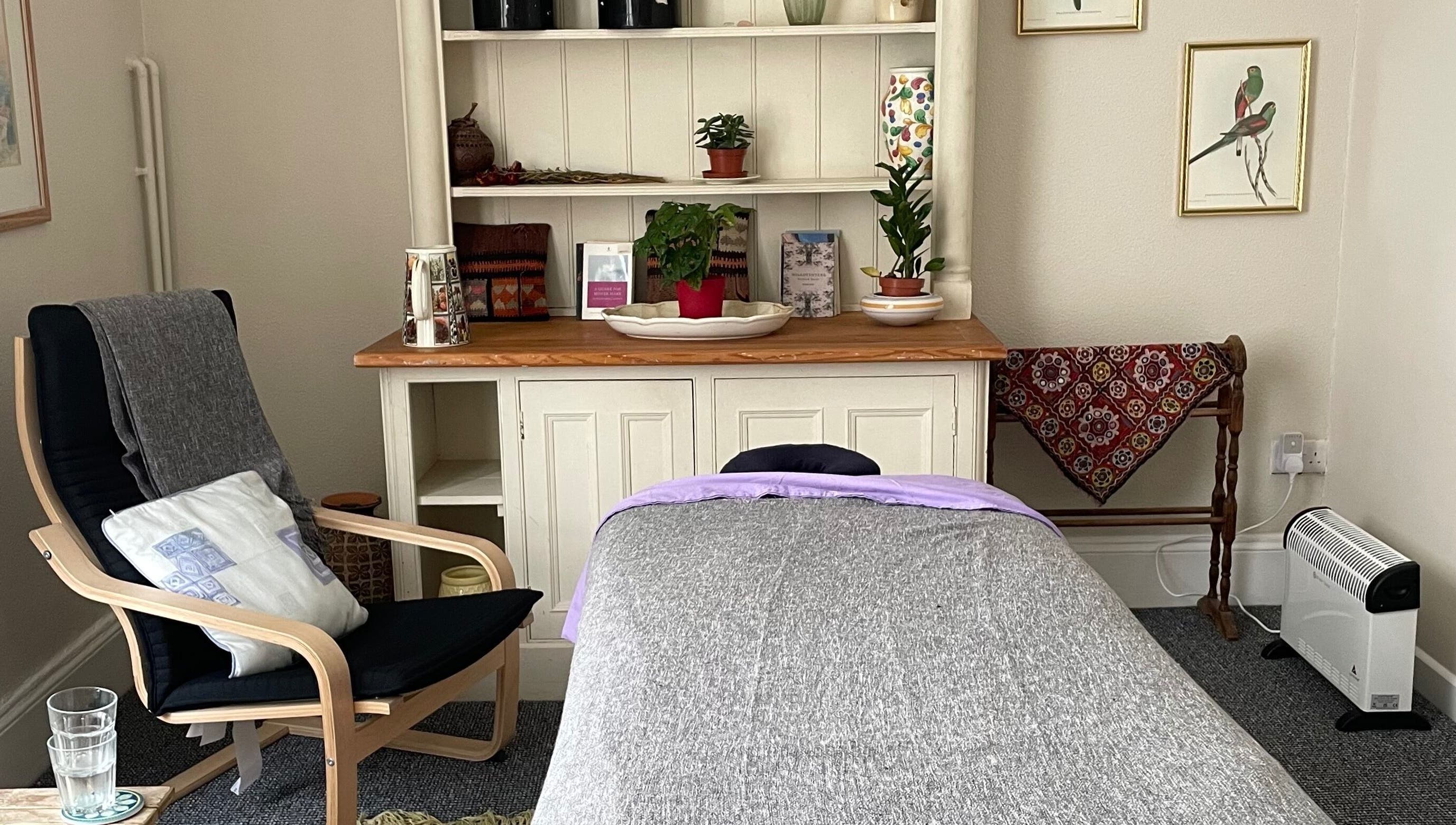 Inviting massage room at Maple Leaf Massage Cardiff in Cardiff, Wales, GB with a cozy chair and calming decor.