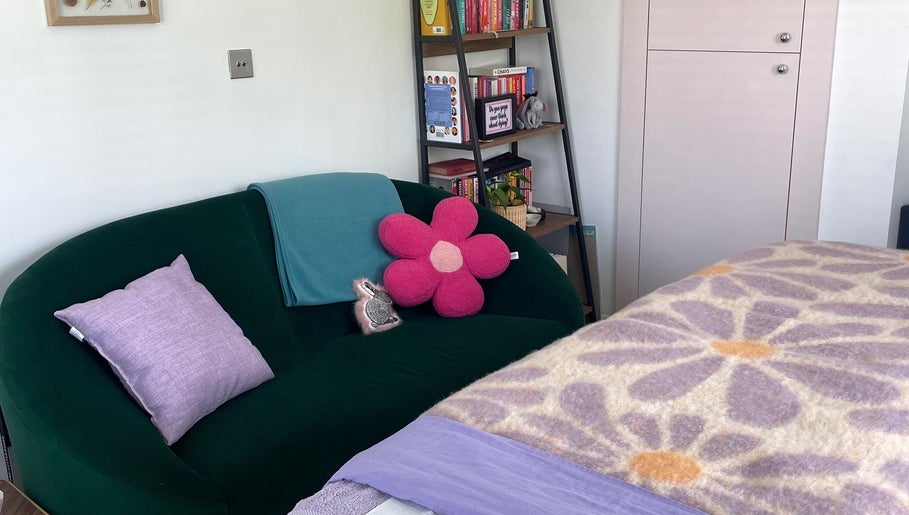 Relaxing lounge area at Maple Leaf Massage Caerphilly, Caerphilly, Wales, GB with vibrant decor.