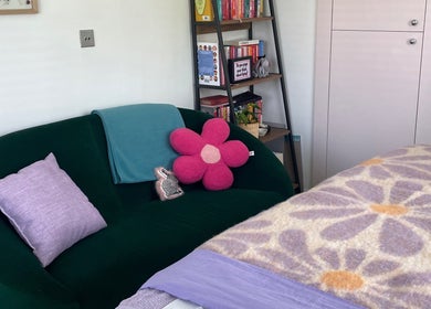 Relaxing lounge area at Maple Leaf Massage Caerphilly, Caerphilly, Wales, GB with vibrant decor.