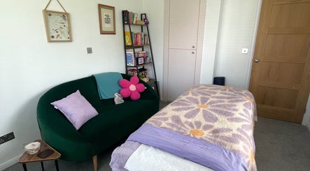 Cozy massage room at Maple Leaf Massage Caerphilly with a floral blanket in Caerphilly, Wales, GB.