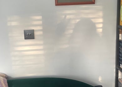 Cozy reading nook at Maple Leaf Massage Caerphilly, Caerphilly, Wales, GB, with books and soft lighting.