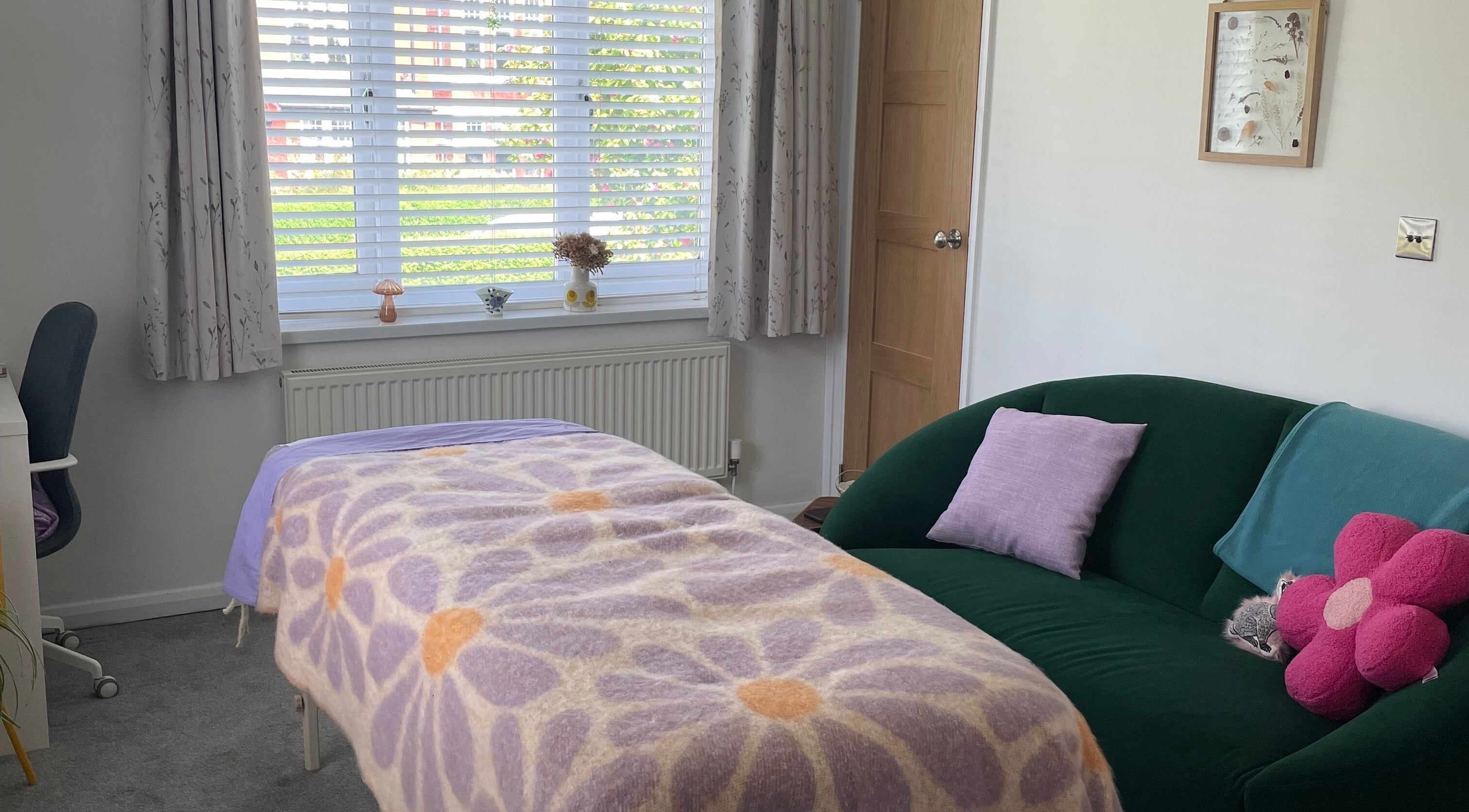 Cozy massage room at Maple Leaf Massage Caerphilly, showcasing a flower-themed blanket in Caerphilly, Wales, GB.