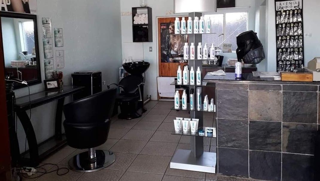Interior of Hair on Terrace in Benoni, Gauteng, ZA featuring styling chairs and product displays.