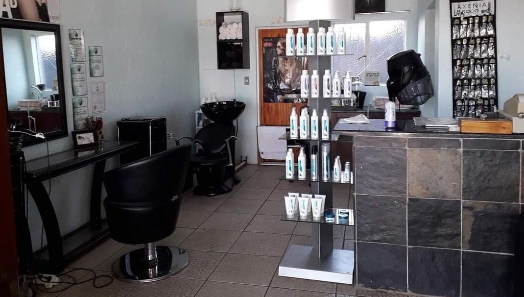 Interior of Hair on Terrace in Benoni, Gauteng, ZA featuring styling chairs and product displays.