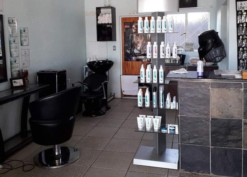 Interior of Hair on Terrace in Benoni, Gauteng, ZA featuring styling chairs and product displays.