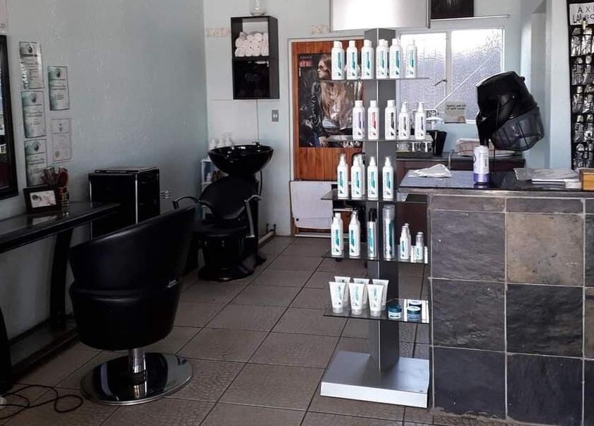 Interior of Hair on Terrace in Benoni, Gauteng, ZA featuring styling chairs and product displays.