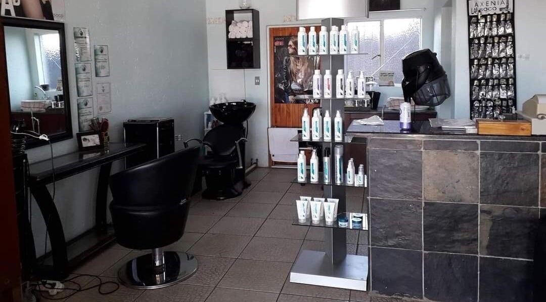 Interior of Hair on Terrace in Benoni, Gauteng, ZA featuring styling chairs and product displays.