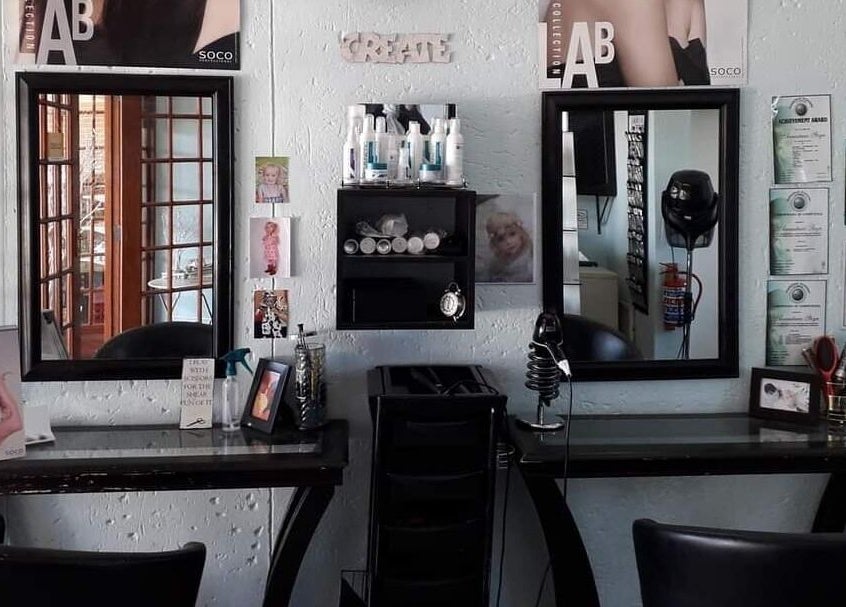 Elegant salon workspace at Hair on Terrace, Benoni, Gauteng, ZA showcasing stylish mirrors and beauty products.