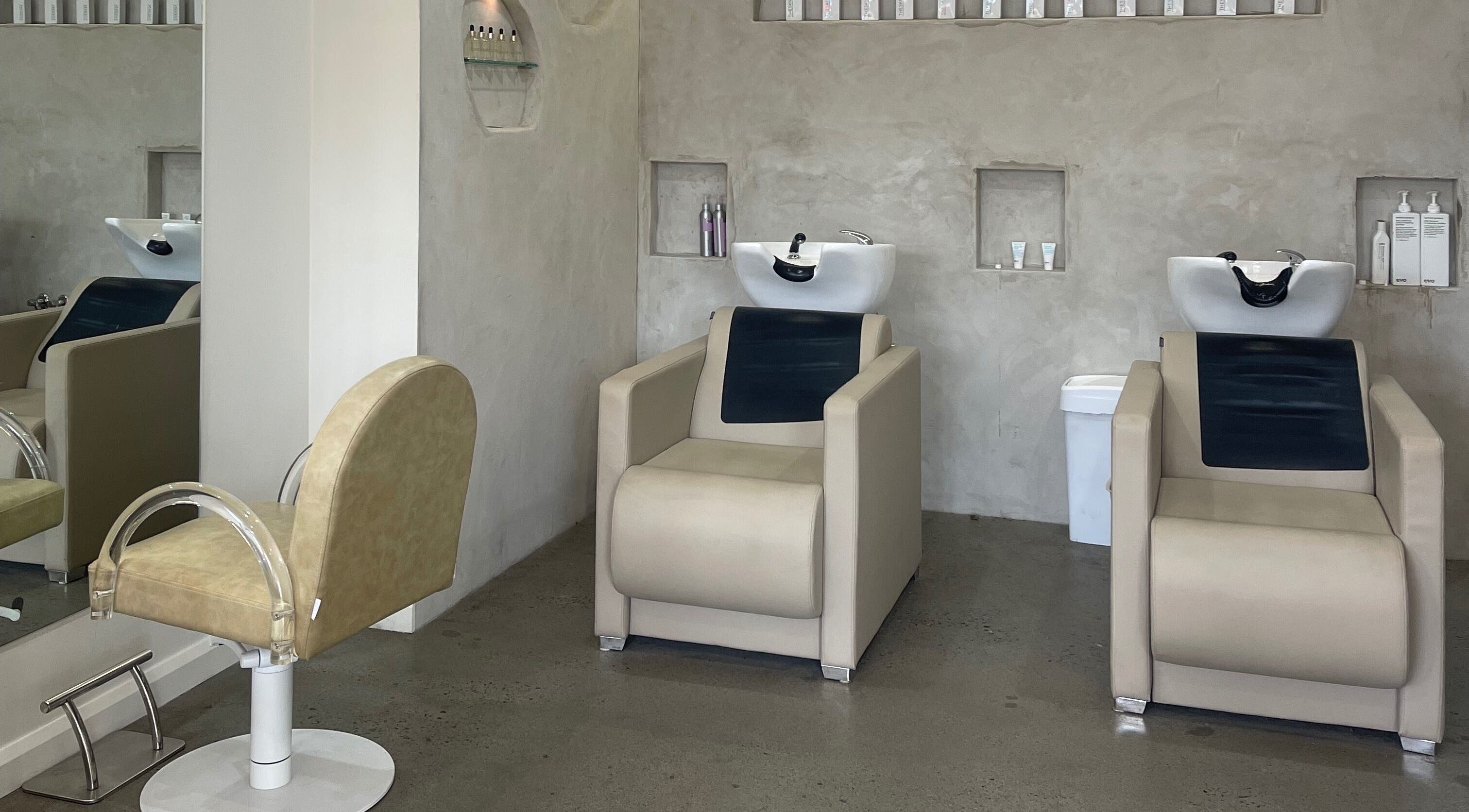 Chic salon wash area at Bayse Hair Goldcoast in Nerang, Queensland, AU with modern beige chairs.