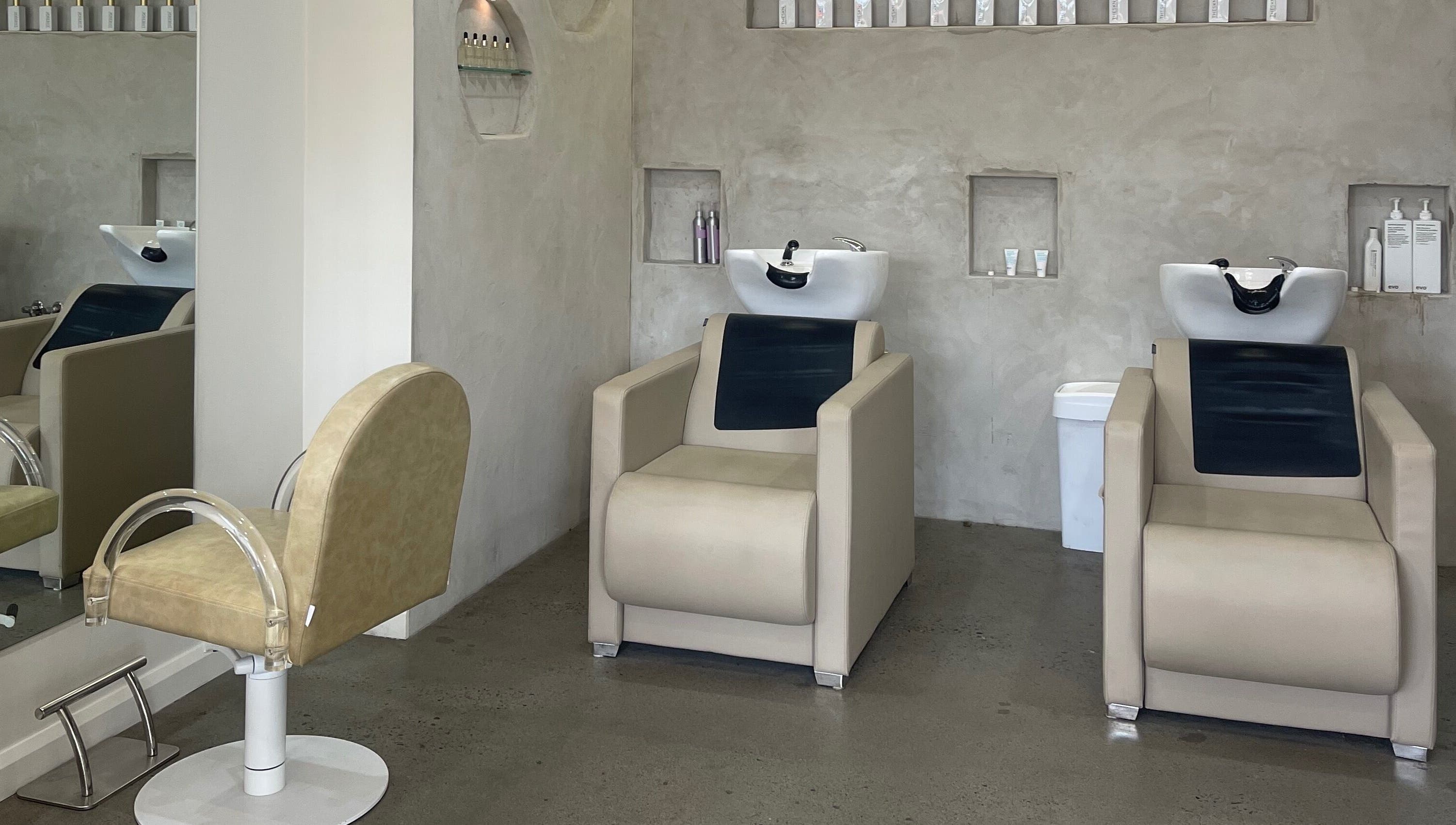 Modern washing and styling chairs at Bayse Hair Goldcoast, Nerang, Queensland, AU. Sleek, minimalist design.