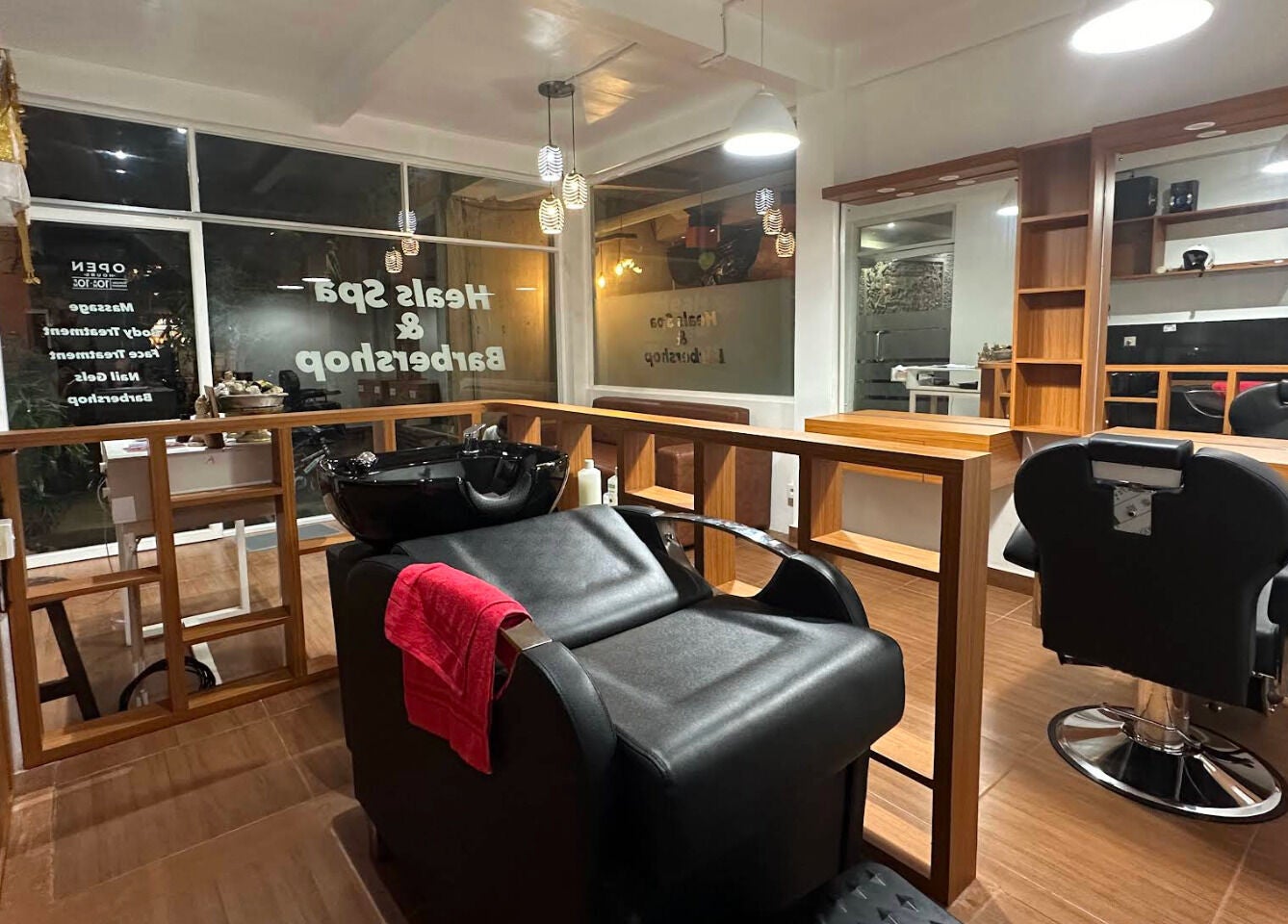 Modern barbershop interior at Heals Spa and Barbershop in Bali, Bali, ID with sleek design and elegant lighting.