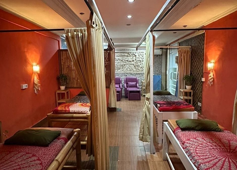 Cozy massage area at Heals Spa and Barbershop, Bali, Bali, ID. Inviting and tranquil with warm lighting.