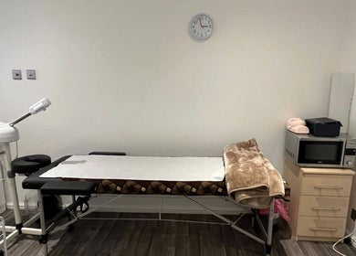 Calming treatment room at Mist Beauty in Southend-on-Sea, England with massage table and amenities.