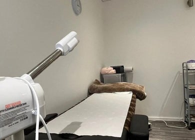 Relaxing treatment room at Mist Beauty, Southend-on-sea, England, GB with equipment and a comfortable bed.