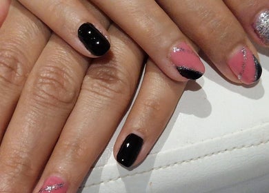 Stylish glitter and black nail art at Mist Beauty, Southend-on-sea, England, GB.