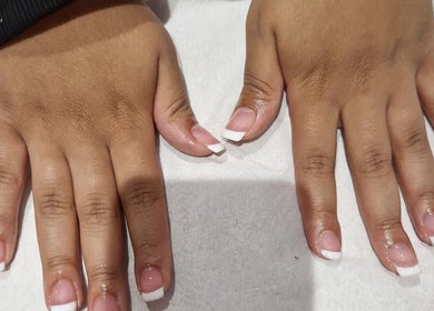 Freshly manicured hands with French tips at Mist Beauty, Southend-on-sea, England, GB.