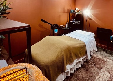 Tranquil treatment room at Skin & Dosha South Bank Studio, London, England, GB with a cozy massage bed.