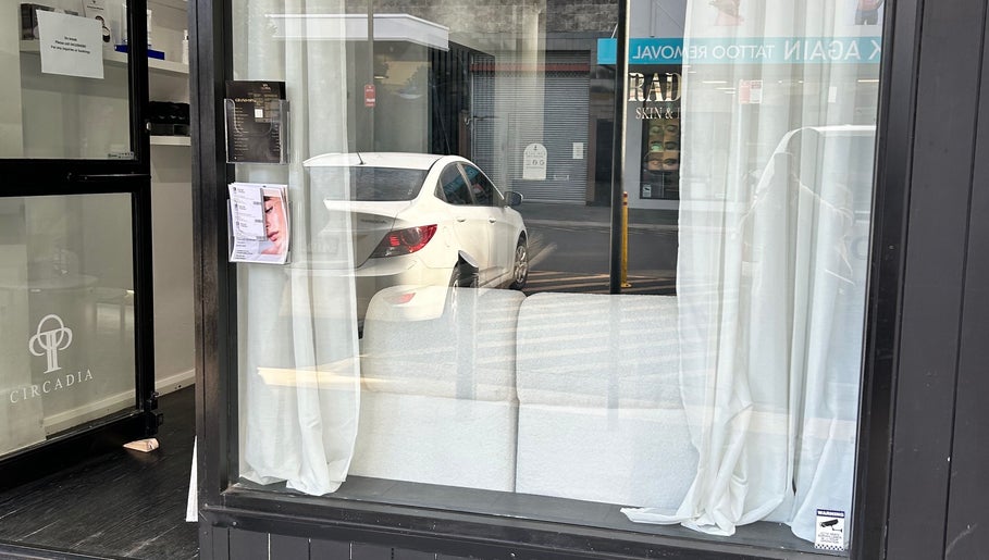 Front window view of Grace Brows & Beauty in Penrith, New South Wales, AU with sheer curtains.