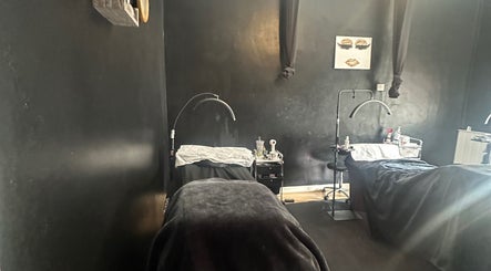 Calm treatment room at Haru Beauty in Wigan, England, GB with dim lighting and modern decor.