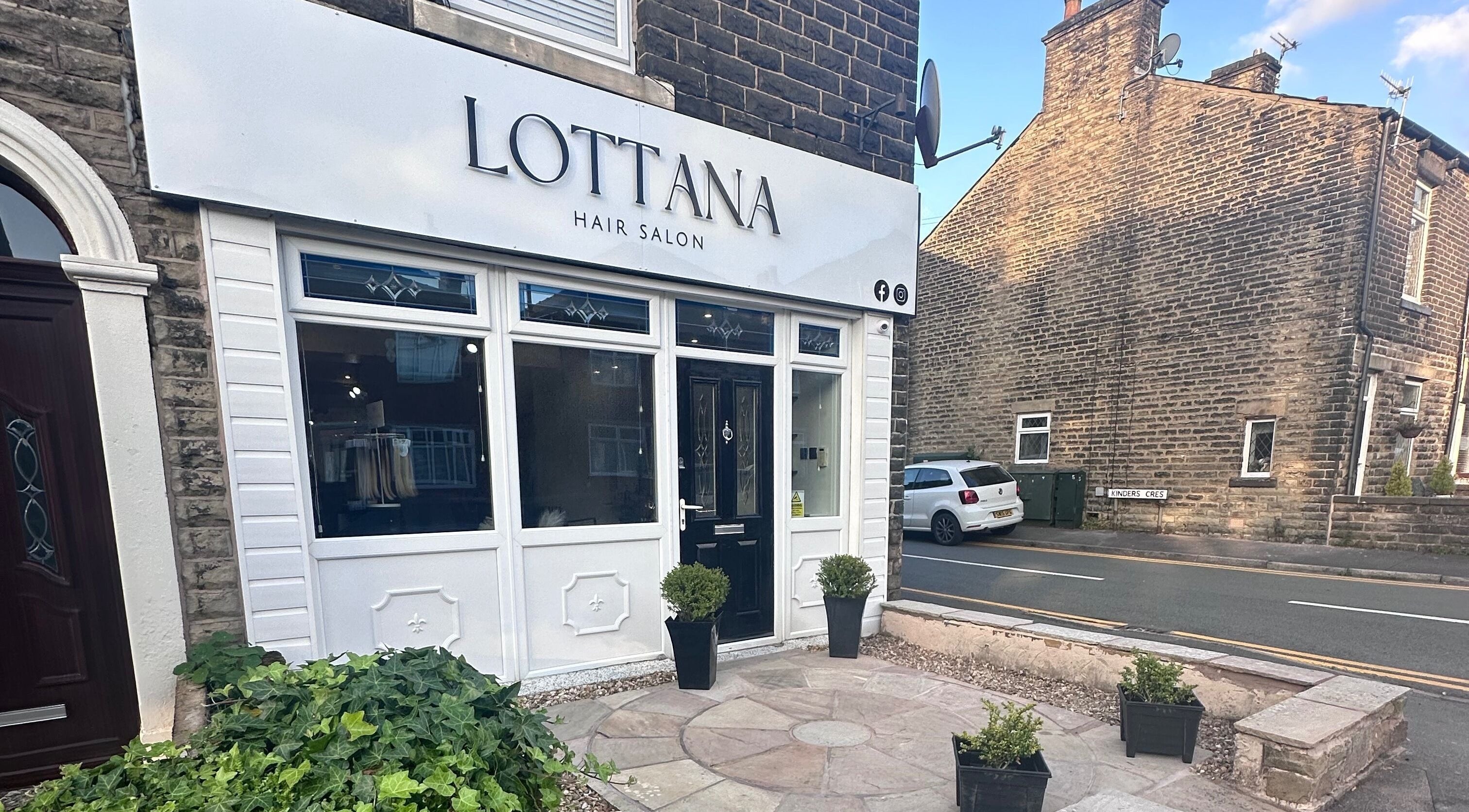 Exterior of Lottana Hair Salon in Greenfield, England, GB, showcasing its modern and inviting facade.