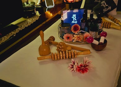 Massage tools on a serene table setup at Rody Luxury Home Spa, Dubai, Dubai, AE for ultimate relaxation.