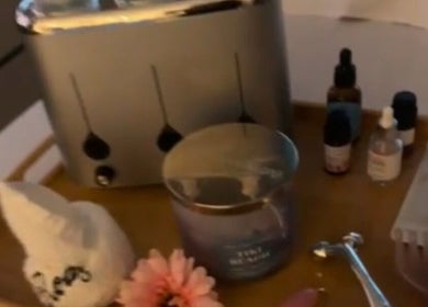 Relaxing spa tray at Rody Luxury Home Spa, Dubai, Dubai, AE with oils, candles, and a soothing vibe.