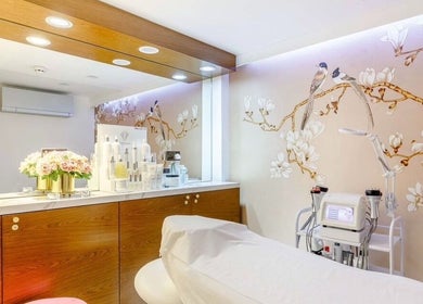 Elegant treatment room at Anna’s Hair and Beauty in London, England, GB with floral wall design and modern decor.