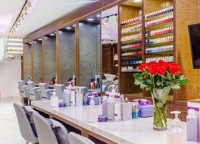 Elegant interior of Anna’s Hair and Beauty in London, England, GB showcasing styling stations and vibrant decor.