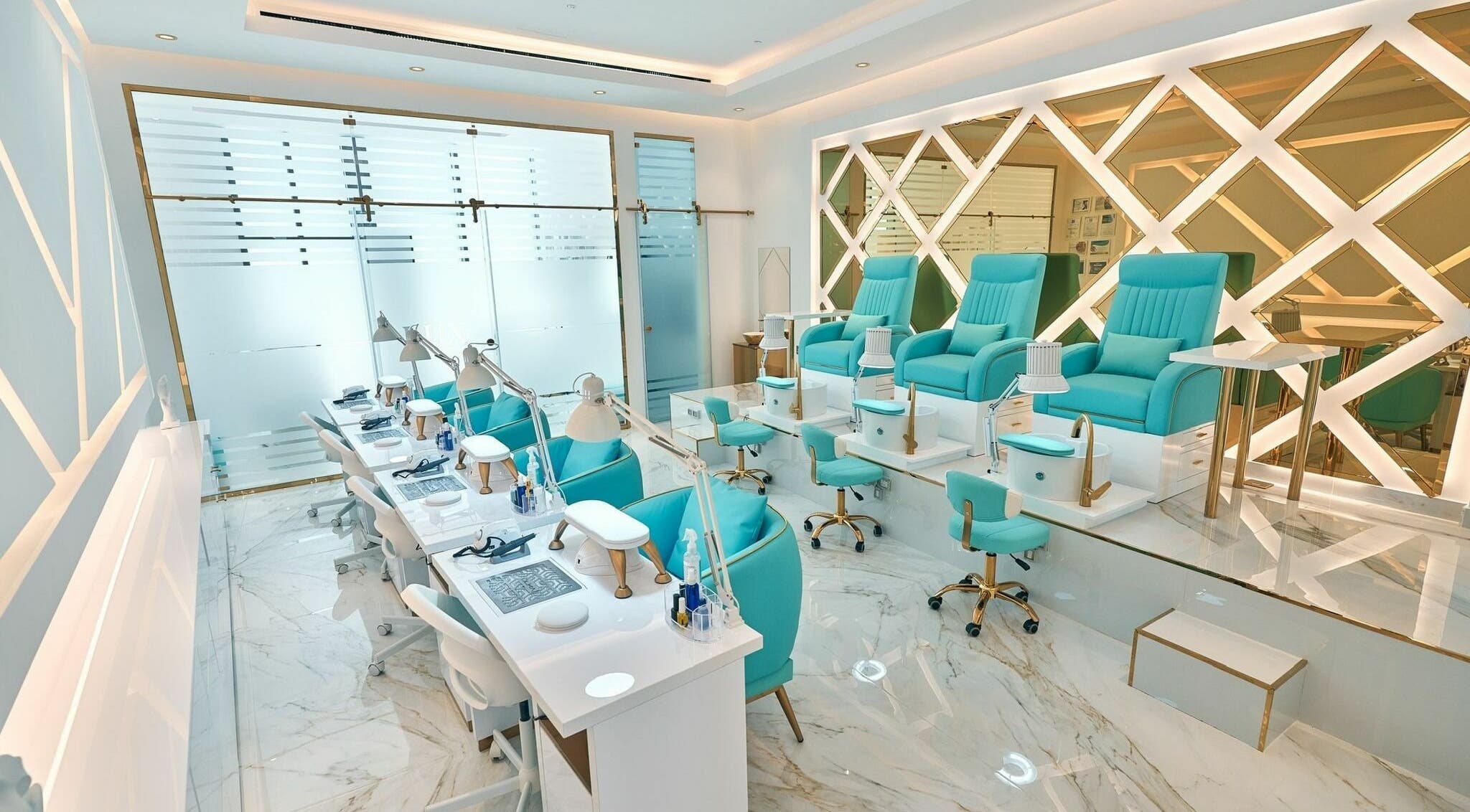 Elegant interior of LUX Beauty Salon in Doha, Doha Municipality, QA with plush aqua chairs and luxe decor.