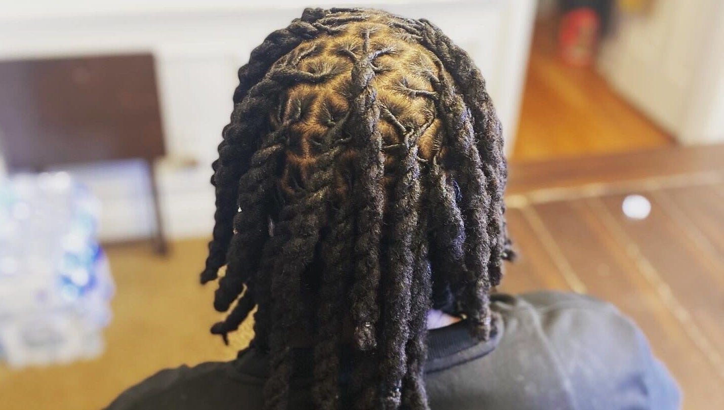 Intricate dreadlocks styling at Dreads by Day, Decatur, Georgia, US showcasing detailed twist pattern.