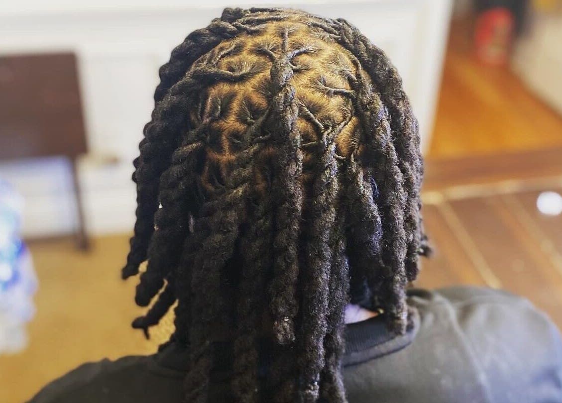 Intricate dreadlocks styling at Dreads by Day, Decatur, Georgia, US showcasing detailed twist pattern.
