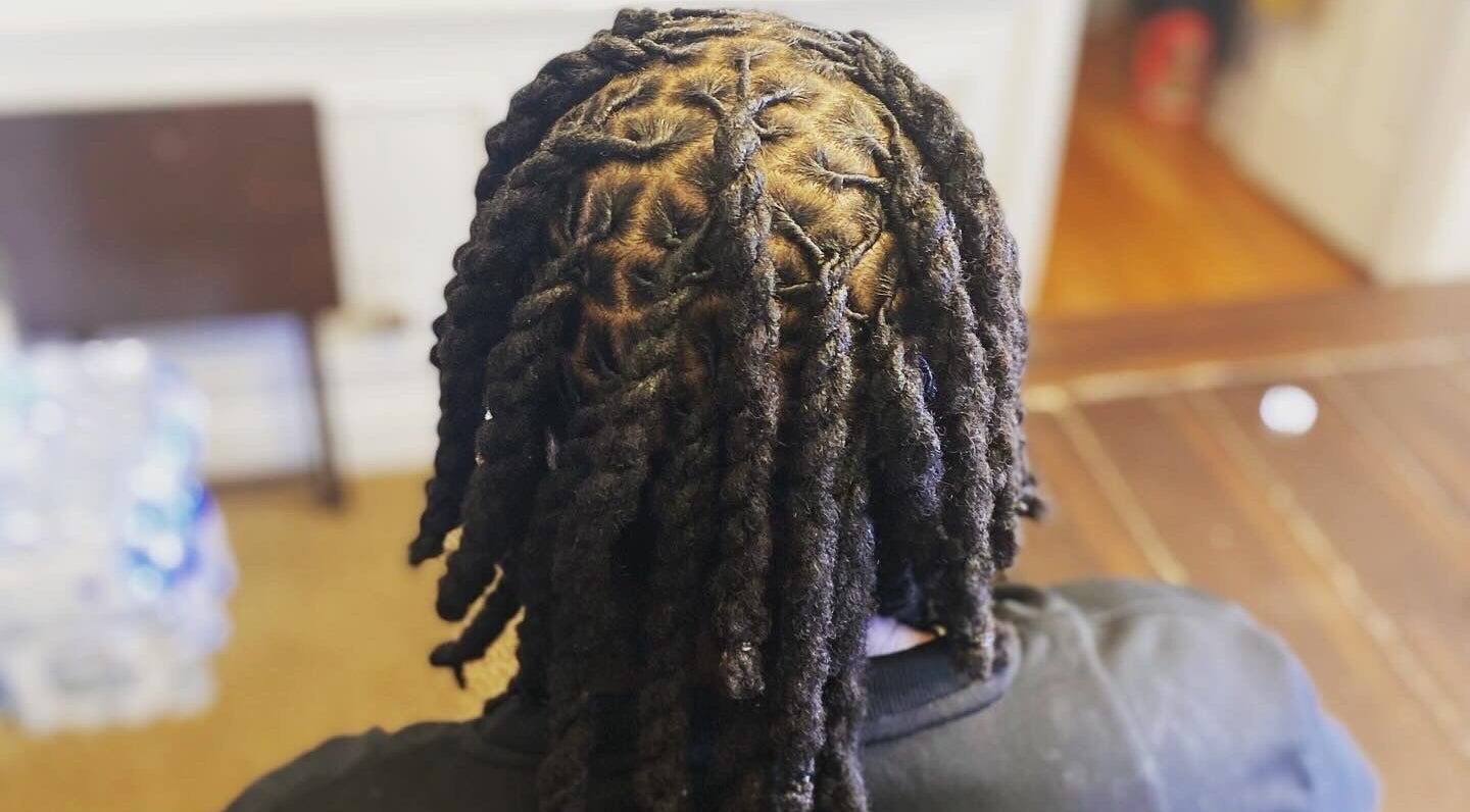 Intricate dreadlocks styling at Dreads by Day, Decatur, Georgia, US showcasing detailed twist pattern.
