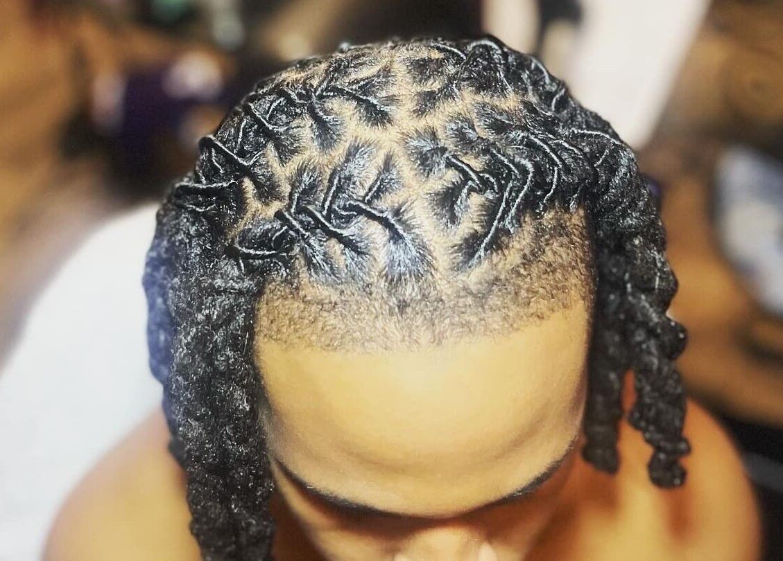 Detailed twist hairstyle at Dreads by Day in Decatur, Georgia, US, showcasing professional hair design.
