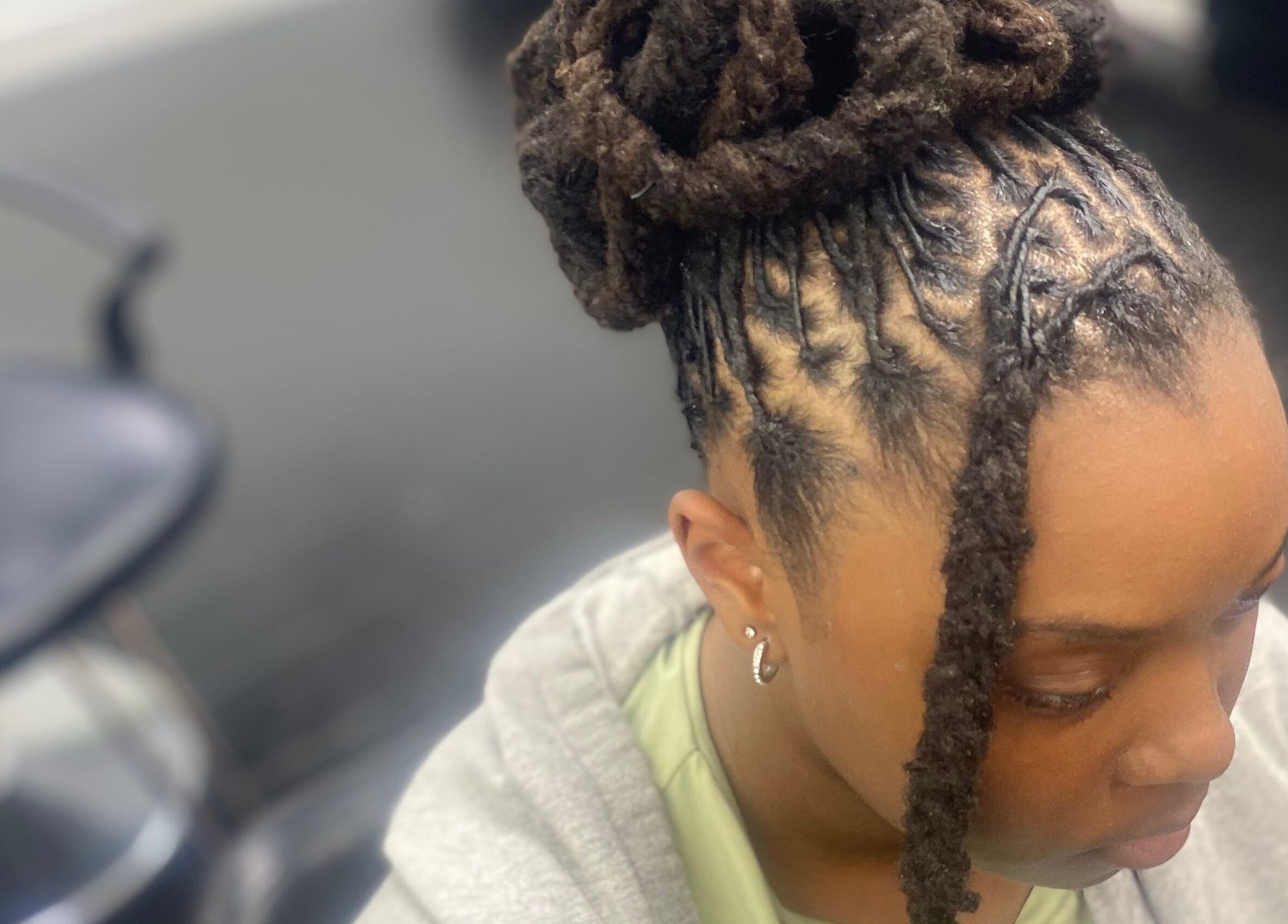 Close-up of intricate braided hairstyle at Dreads by Day, Decatur, Georgia, US.
