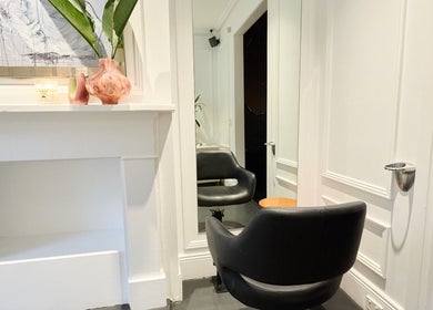 Modern salon chair by mirror in Jade Clifton Hair, Paddington, New South Wales, AU.