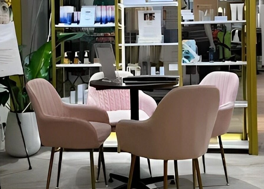 Cozy seating area at Momo Beauty Tokyo, Bukit Bintang, MY, featuring plush chairs and elegant decor.