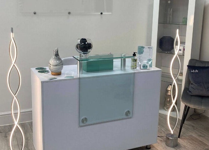 Chic reception area at Mollie Elise Aesthetics, Chorley, England, GB, featuring modern design and lighting.