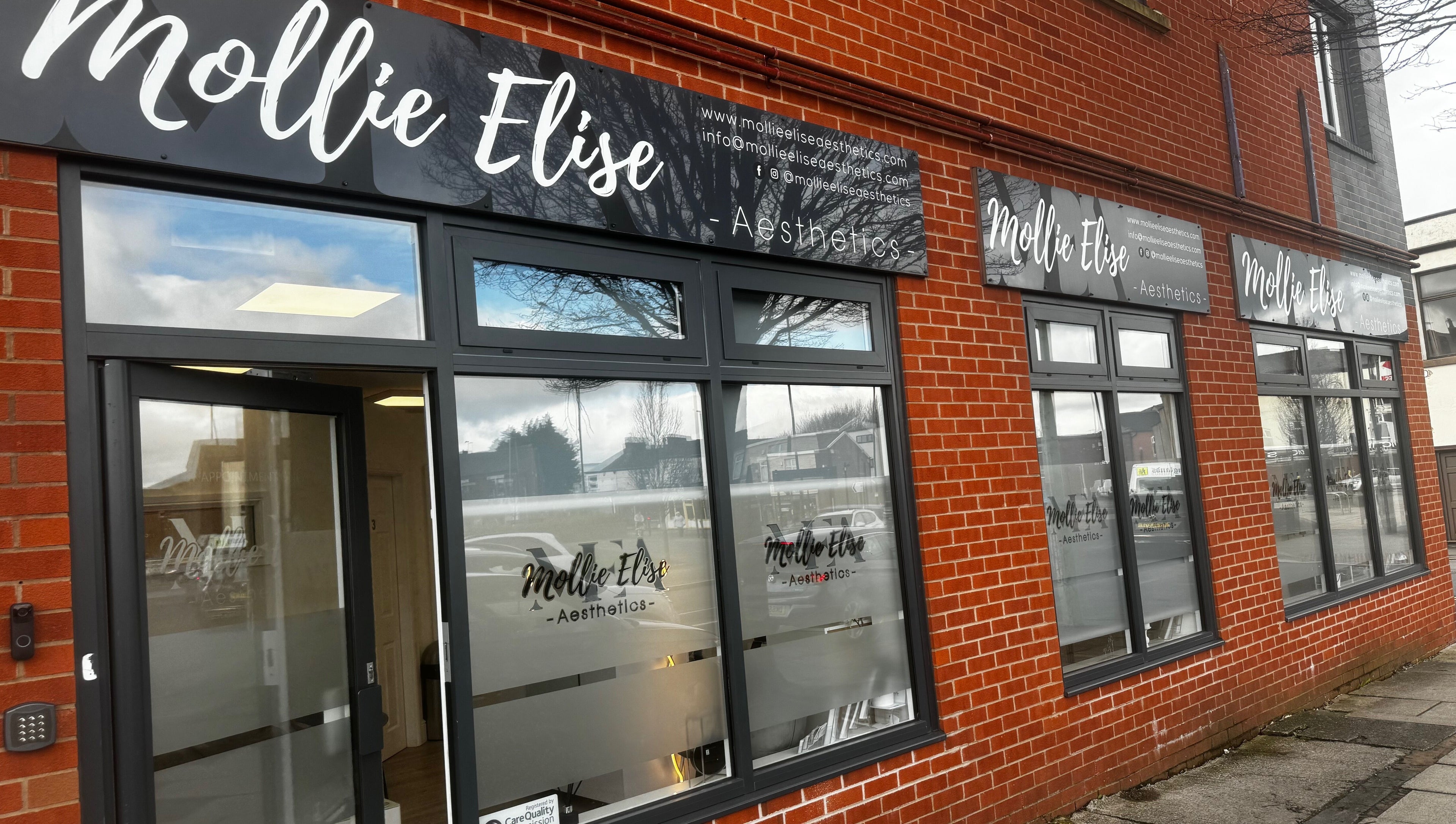 Exterior of Mollie Elise Aesthetics in Chorley, England, GB, showcasing modern windows and signage.