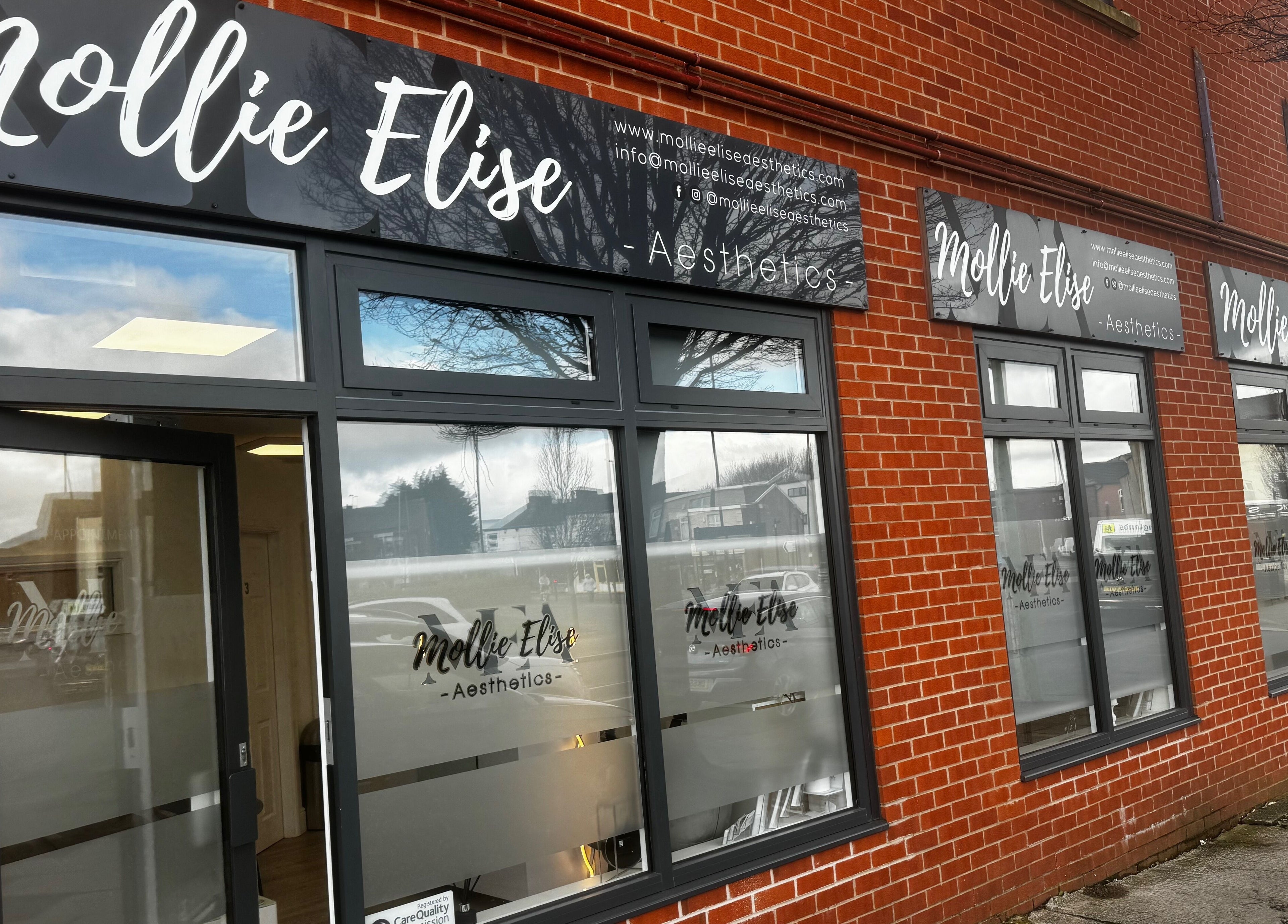 Exterior of Mollie Elise Aesthetics in Chorley, England, GB, showcasing modern windows and signage.
